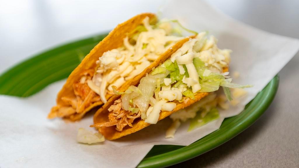 Tacos · Choice of chicken or beef, topped with lettuce and shredded cheese