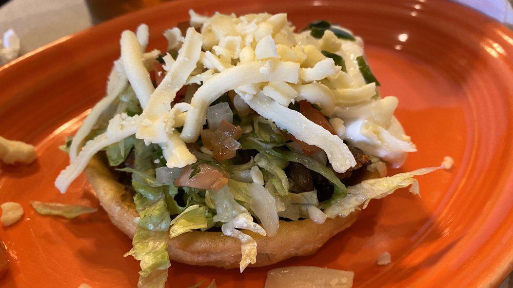 Sopes · Crispy thick cornmeal shell, with your choice of meat. Topped with lettuce, sour cream, shredded cheese and pico de gallo.