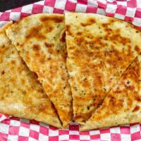 Chicken Quesadillas · Chunks of grilled chicken breast and melted mexican cheeses inside a grilled tortilla. Serve...