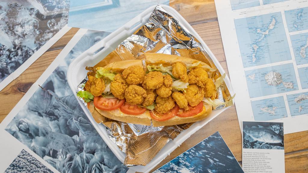 *Fried Shrimp Po Boy · A generous portion of fried shrimp served on a toasted hoagie roll with lettuce, tomatoes, and your choice of sauce.