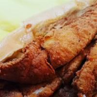 *Fried Catfish Po Boy · Two fried Catfish filets served on a toasted hoagie roll with lettuce, tomatoes, and your ch...