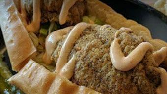 *Fried Flounder Po Boy · Four strips of fried flounder served on a toasted hoagie roll with lettuce, tomatoes, and yo...