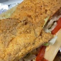 *Fried Tilapia Po Boy · Two strips of fried Tilapia on a toasted hoagie roll with lettuce, tomatoes, and your choice...