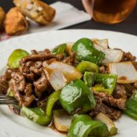 Pepper Steak · Stir-fried steak with vegetables and a savory sauce.
