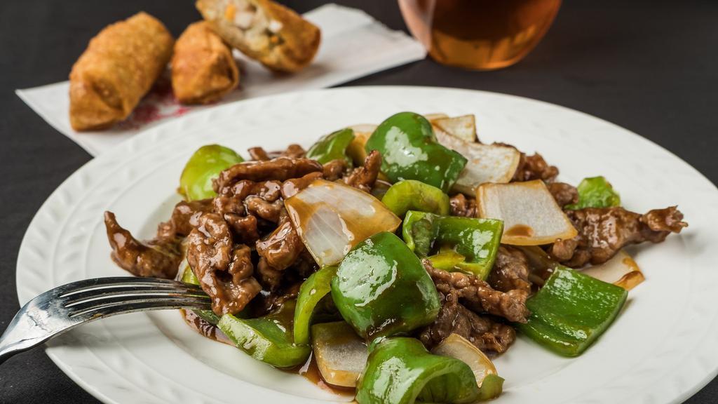 Pepper Steak · Stir-fried steak with vegetables and a savory sauce.