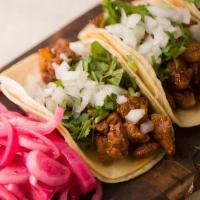 Gringa Tacos · 5 Mini Tacos on corn or flour tortillas, Marinated Pork,  Pine apple, Jack Cheese, Cilantro,...