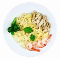 Fettuccine Alfredo · Fettuccine pasta smothered in creamy alfredo sauce and topped with parmesan cheese. Choice o...