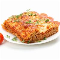 Meat Lasagna · Beef, tomato, mozzarella over layers of tender pasta, topped with marinara sauce and baked w...
