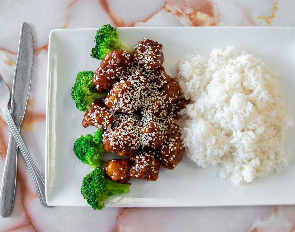 Sesame Chicken · Lightly breaded chunks of chicken deep-fried w. sweet golden sauce and served w. broccoli.
