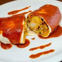 L Breakfast Burrito · Sautéed potatoes with tomatoes, onions with two eggs, and Monterey cheese wrapped in a soft ...