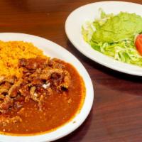Chile Colorado · Spicy. Grilled chicken or steak with green sauce. Served with rice, beans, three flour torti...