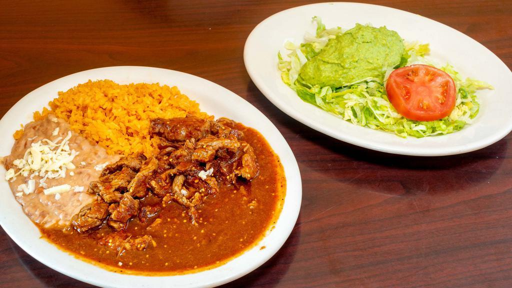 Chile Colorado · Spicy. Grilled chicken or steak with green sauce. Served with rice, beans, three flour tortillas and choice of tossed or guacamole salad with hot red sauce.