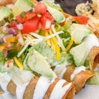 Flautas · 3 deep fried rolled corn tacos filled with chicken and topped with lettuce , shredded cheese...