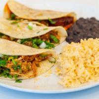 Tacos ( 3 ) · 3 tacos served on soft corn tortillas with the meat of choice , and topped with fresh cilant...