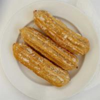 Caramel Filled Churro · Delicious churros fried to order , filled with caramel and coated with cinnamon sugar .