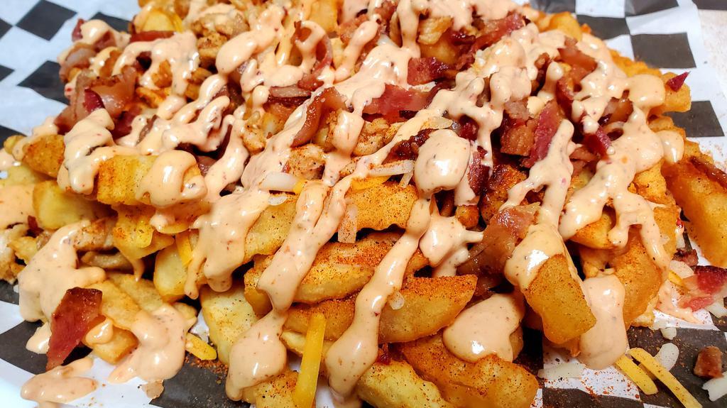 Chipotle Chicken Fries · Cajun Fries w/ shredded cheese, bacon, grilled chicken, & topped w/ house-made Chipotle sauce