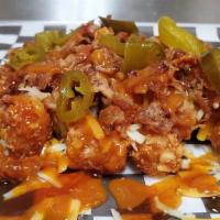Rancho Pulled Pork Tots · Rancho Pulled Pork Tots
Tater Tots w/ Shredded Cheese & Pulled Pork BBQ, Drizzled w/ Golden ...