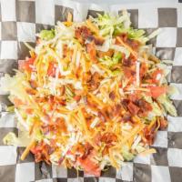 Grilled Chipotle Chicken Salad · Grilled Chicken w/ bacon, cheese, and tomatoes on top a bed of shredded lettuce drizzled w/ ...
