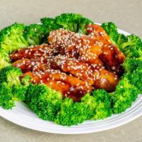 Sesame Chicken · Deep fried white-meat chicken pieces tossed in a sweet sesame sauce, garnished with steamed ...