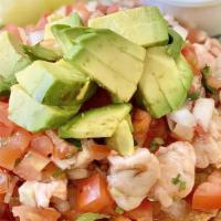 Ceviche · Marinated with lime juice and served with cilantro, onions, tomatoes and avocado.