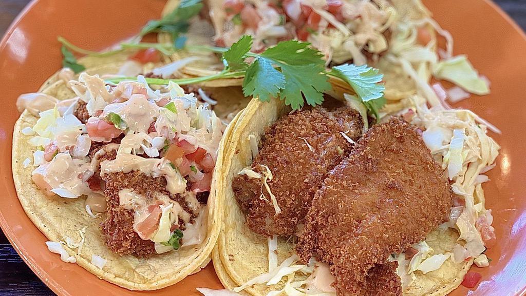 California Fish Tacos · Three tacos with tilapia, chipotle sauce, cabbage, pico de gallo, avocado and served with rice.