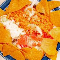 Chimichangas · Two flour tortillas, fried or soft, chicken or beef, topped with cheese dip and sour cream s...