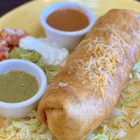 Chimichanga · Soft or fried tortilla filled with beef tips or chicken. topped with cheese dip sour cream s...