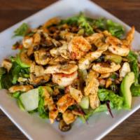 Azteca Salad · Grilled shrimp, chicken and mushrooms on a bed of Romain lettuce with cheese pico de gallo a...
