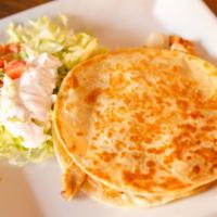 Quesadilla Ranchera · One quesadilla filled with beans, cheese, onions and your choice of grilled chicken or steak.