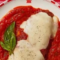 Chicken Parmesan · Parmesan chicken breast over spaghetti topped with marinara sauce and baked with mozzarella ...