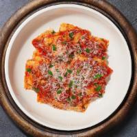 Cheese Ravioli · Ravioli pasta stuffed with ricotta, parmesan, and mozzarella topped with marinara sauce and ...