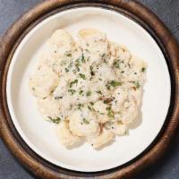 Tortellini Alfredo  · Tortellini pasta cooked al dente tossed in creamy white sauce topped aged parmesan.