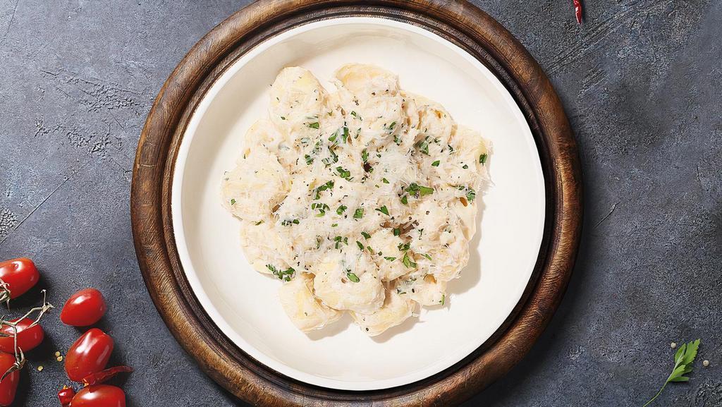 Tortellini Alfredo · Cheese tortellini with Alfredo sauce and topped with parmesan cheese