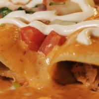Enchiladas Chipotle · Three shredded chicken enchiladas. Topped with a creamy chipotle sauce, sour cream and pico ...