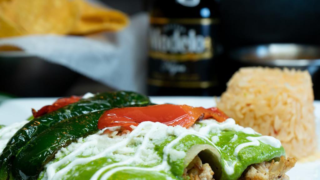 Spinach & Chicken Enchiladas · Three corn tortillas stuffed with chicken and spinach, topped with our delicious roasted poblano salsa and queso fresco served with rice.
