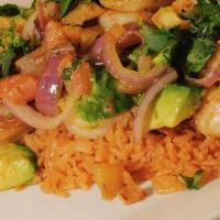 Camarones Al Mojo De Ajo · Jumbo shrimp sautéed in garlic butter with avocado chunks with guajillo flavor. Served with ...