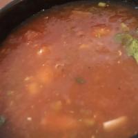 Caldo De Res · Beef soup. A large bowl of beef soup (Mexican style) with cabbage, carrots, celery, onions, ...