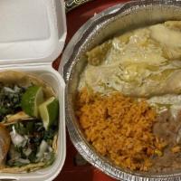 Enchiladas Verdes · 2 enchiladas, choice of chicken, cheese or beef served with rice and beans topped with speci...