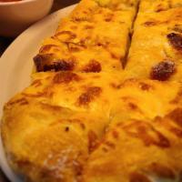 Cheesy Garlic Bread · A delicious creation of dough, cheese and love. It's a fluffy dough topped with garlic oil, ...