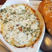 Spinach Artichoke Dip · Our Made from scratch dip with 5 cheeses, spinach, artichokes, and love.
Served with Toasted...