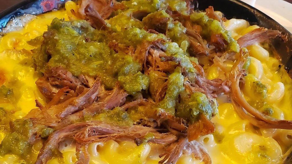 Smoked Cochon De Lait Mac And Cheese · It's a large portion of our in-house smoked cochon de lait over our delicious Mac and cheese topped with a mouth watering smoked poblano sauce.