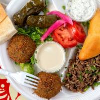 Vegetarian Platter · Select (four) from: grape leaves, hummus, falafel, mutabal, rice, tabbouleh, mujaddara, spin...