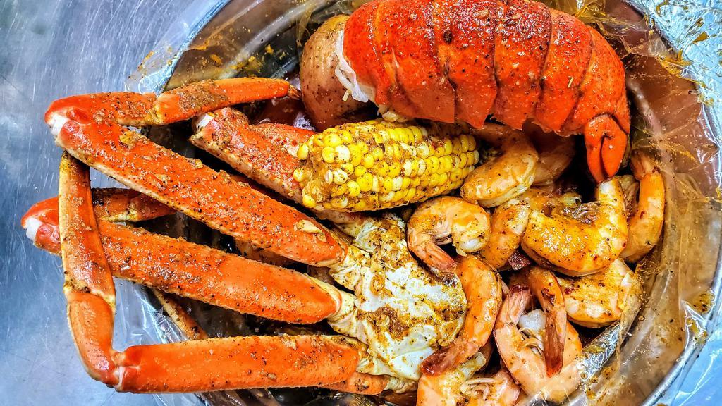 Combo C · includes:5 eggs, 5 corn ,10 potatoes,Lobster(2 tails), snow crab legs(4 cluster) shrimp (No Head) (2 LB),sausage(1LB)