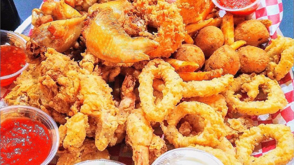Red Hook Sampler · Catfish (2), chicken wings (6), shrimp (6), calamari (8), soft shell crab (2), hushpuppies (6) & cajun fries.