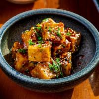 Sizzling Wok Tofu · Tender tofu sautéed with sliced chicken and shrimp in a light brown sauce with mixed vegetab...