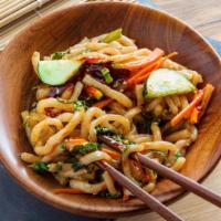 Spicy Sautéed Udon · Spicy. Sautéed udon noodles with Napa, carrot, zucchini and onion scallion zled with hot chi...