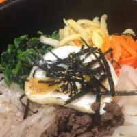 Bibimbap · Steamed white rice with beef or chicken with vegetables and a fried egg on top (sunny side u...