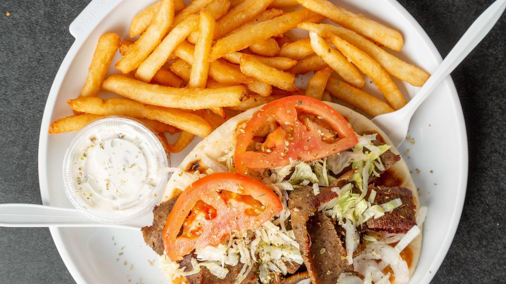 Gyro Sandwich · Served with lettuce, tomato, onions, and cucumber sauce.