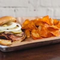 Beef Brisket Sandwich · From the smoker. Texas style brisket with sliced pickles and onions on a brioche bun.