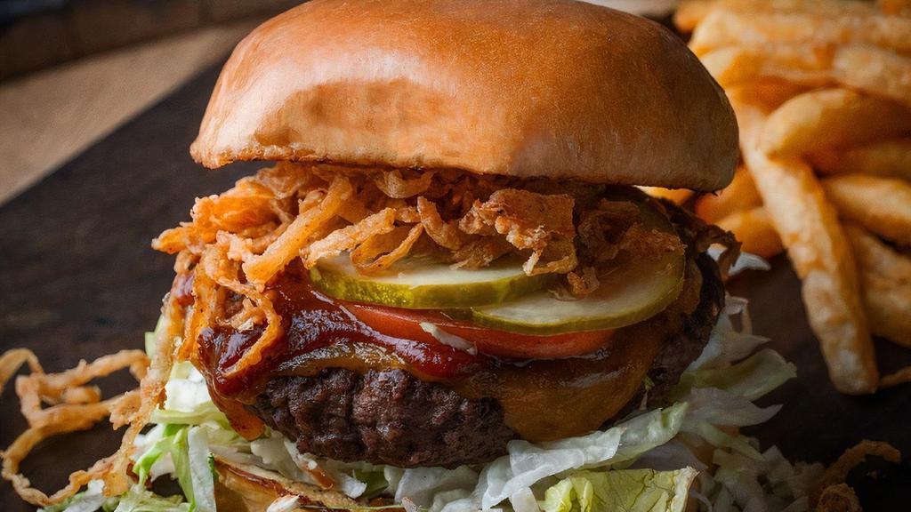 Smokehouse Burger · Burger. 1/2 pound all-beef patty with BBQ sauce, tobacco onions, lettuce, pickles and tomato. served with fries.